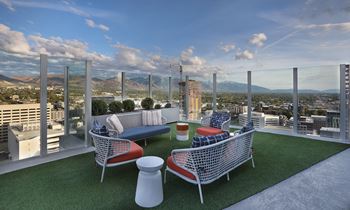 Rooftop lounge seating with mountain views